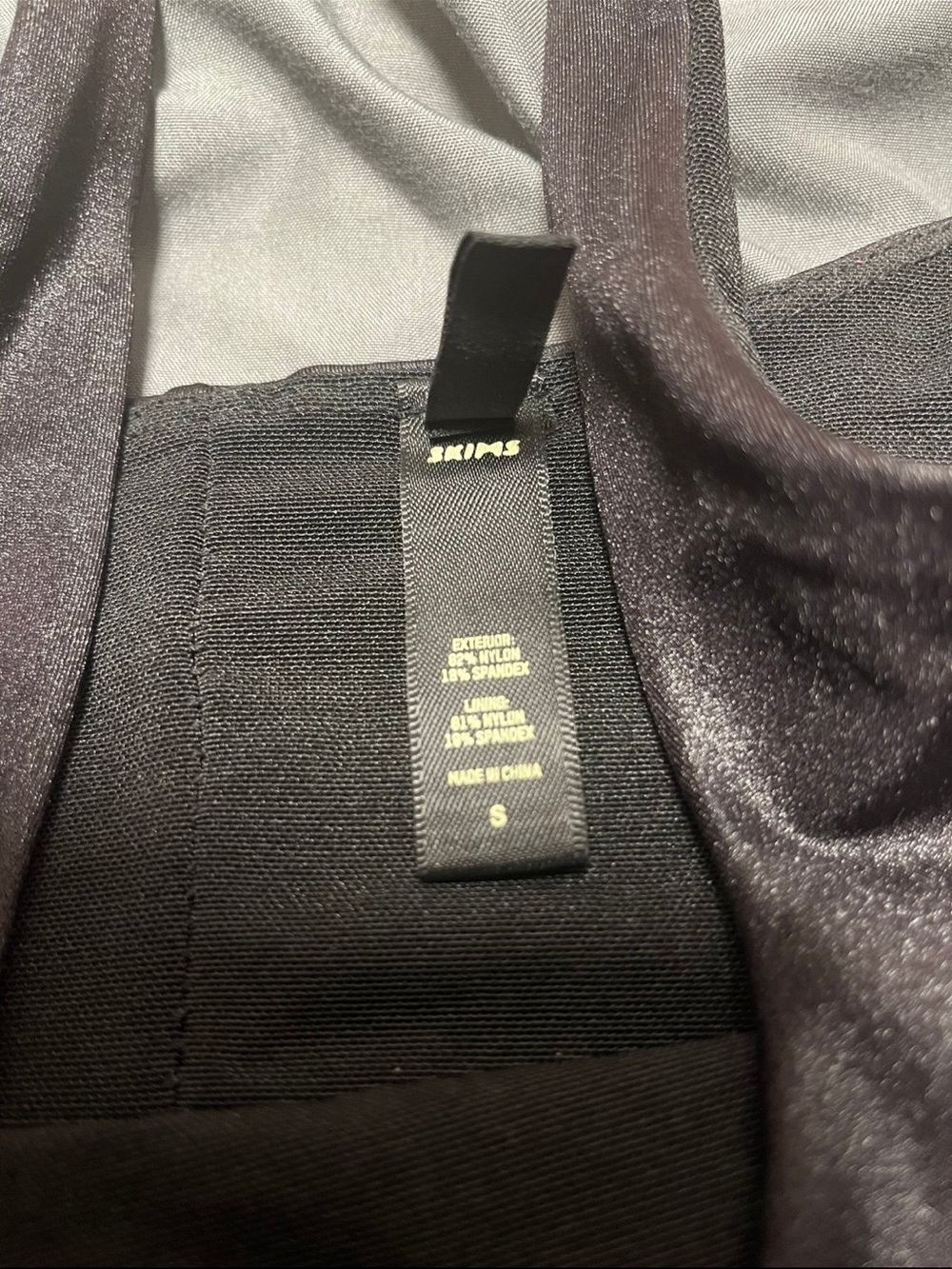 SKIMS Black Shimmery Satin-Look Tank outfit